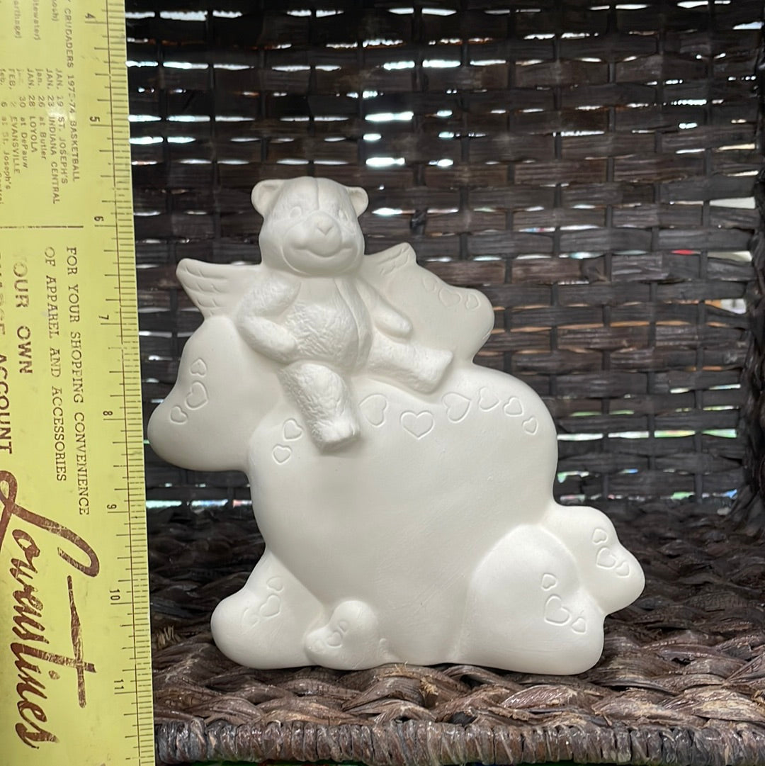 Small heart statue with cupid bear